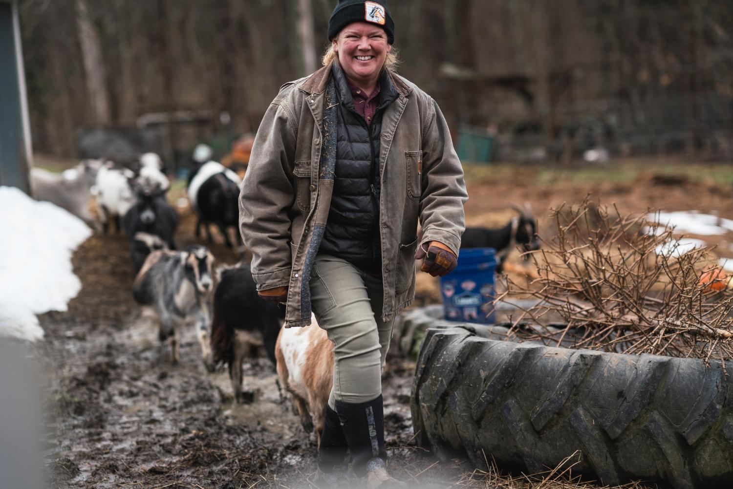 Alice Clarkson leads a herd of goats at Rowandale Farm