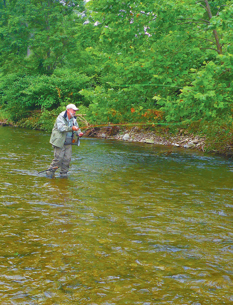 TROUT STREAM FLY-FISHING ROD IN STREAM FOR TROUT SEASON FOR TROUTING BROOK TROUT
