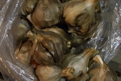 Unpeeled black garlic