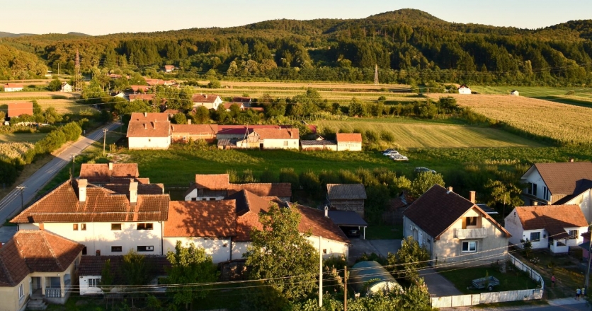 Houses surrounded by food crops create a typical scene in western Serbia. 