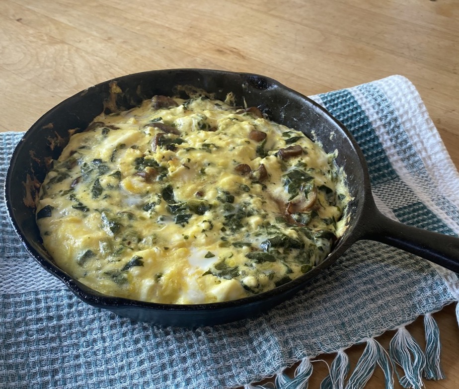 Fresh veggie frittata in an 8-inch skillet.